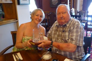 Caroline Pearson receives her trophy from Dave Wedge